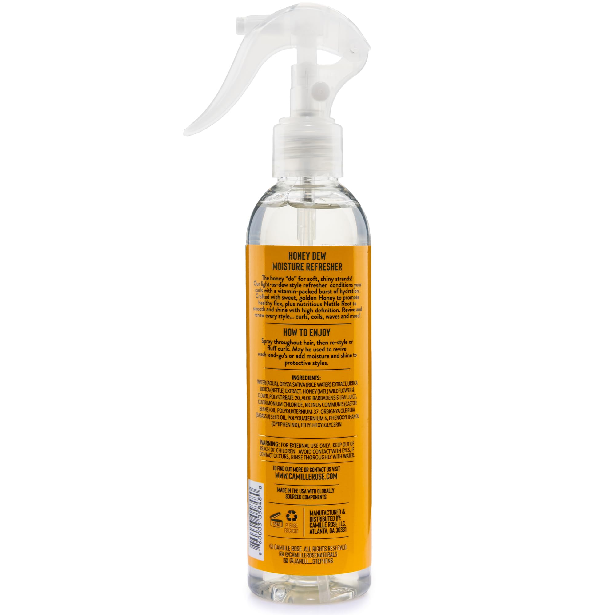 Camille Rose Curl and Detangler Spray mist on curls delivering moisture.