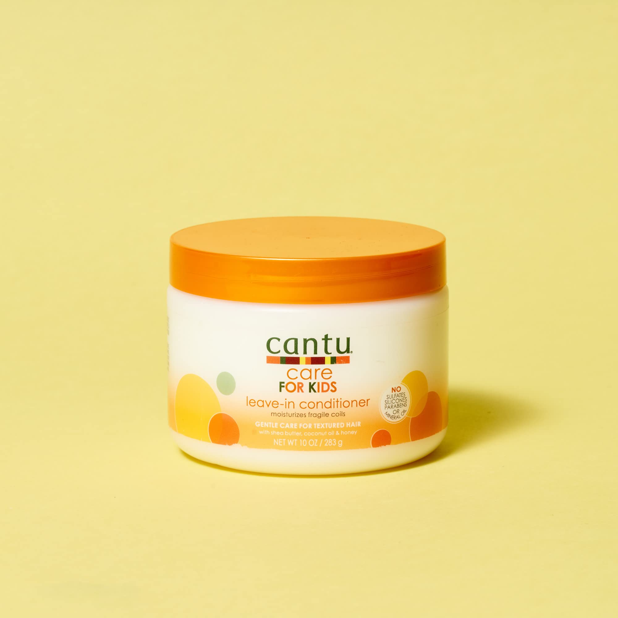 Cantu Care for Kids Leave-In Conditioner on twisted curls for smoother detangling.