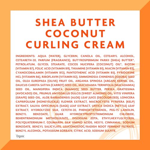 Hands applying Cantu Coconut Curling Cream to damp hair for curl definition.
