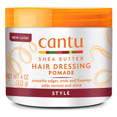 Cantu Hair Dressing Pomade with Shea Butter jar closeup highlighting hydrating shine and smooth definition.