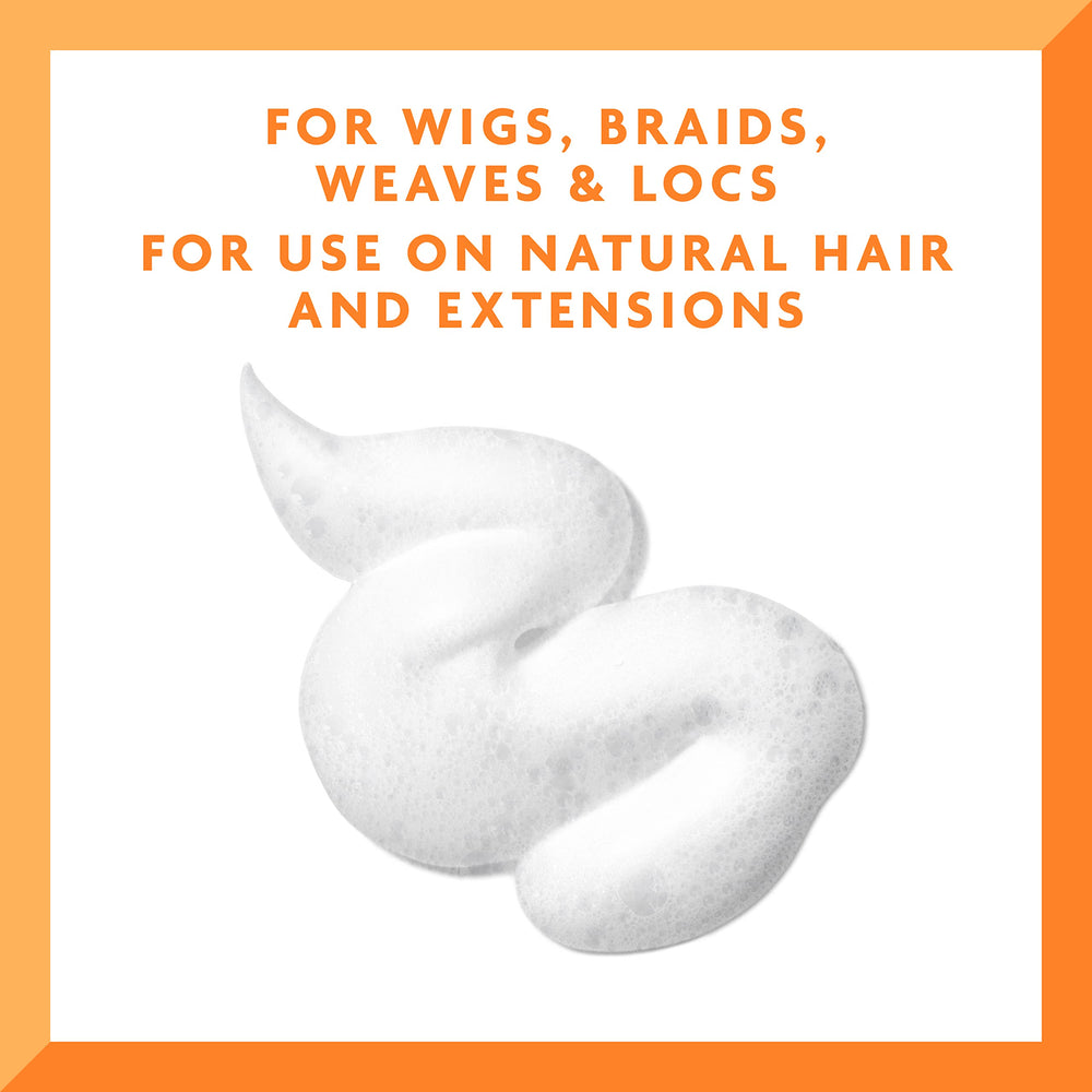 Cantu applied to braided style reviving shine and reducing dryness