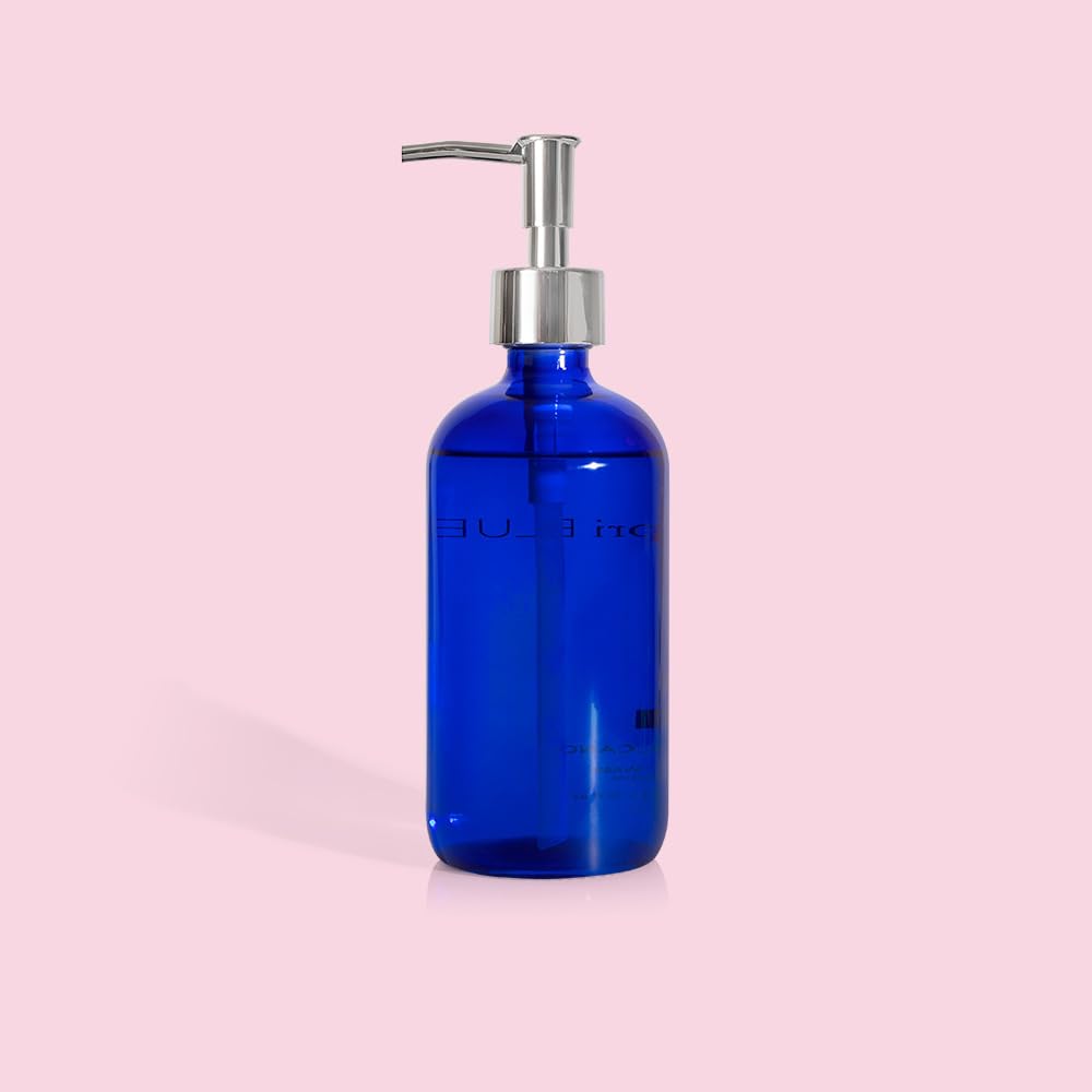 Capri Blue minimalist bathroom setup featuring a cobalt hand wash bottle.