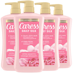 Caress Daily Silk bottle pour with white peach fragrance for a luxurious start.