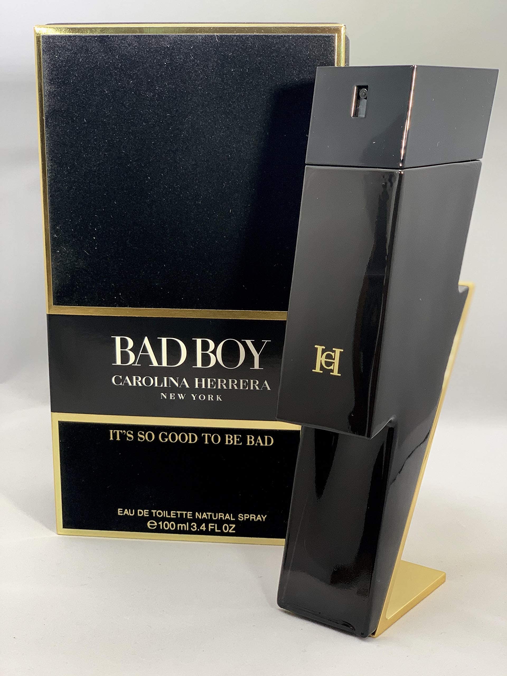 Carolina Herrera Bad Boy bottle with gold piping adds modern edge to dresser.