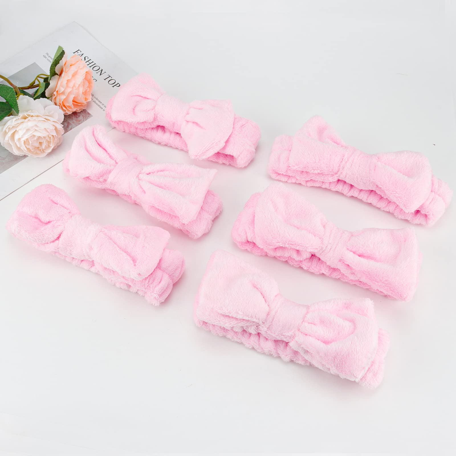 Casoty pink bow headband doubles as costume accessory.