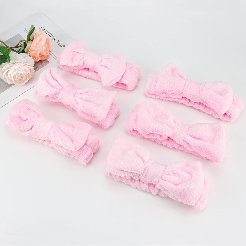 Casoty pink bow headband doubles as costume accessory.
