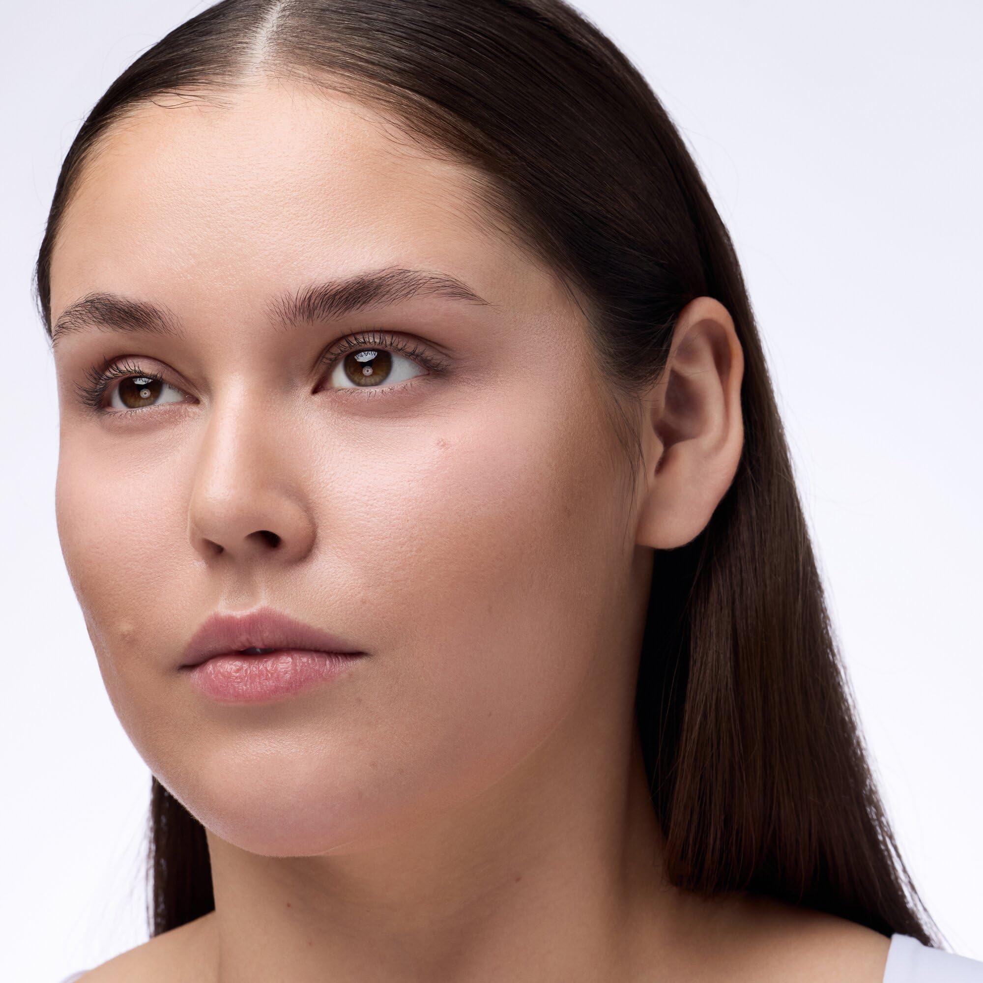 Soft-focus finish of Catrice powder creating a natural glow under-eye area.