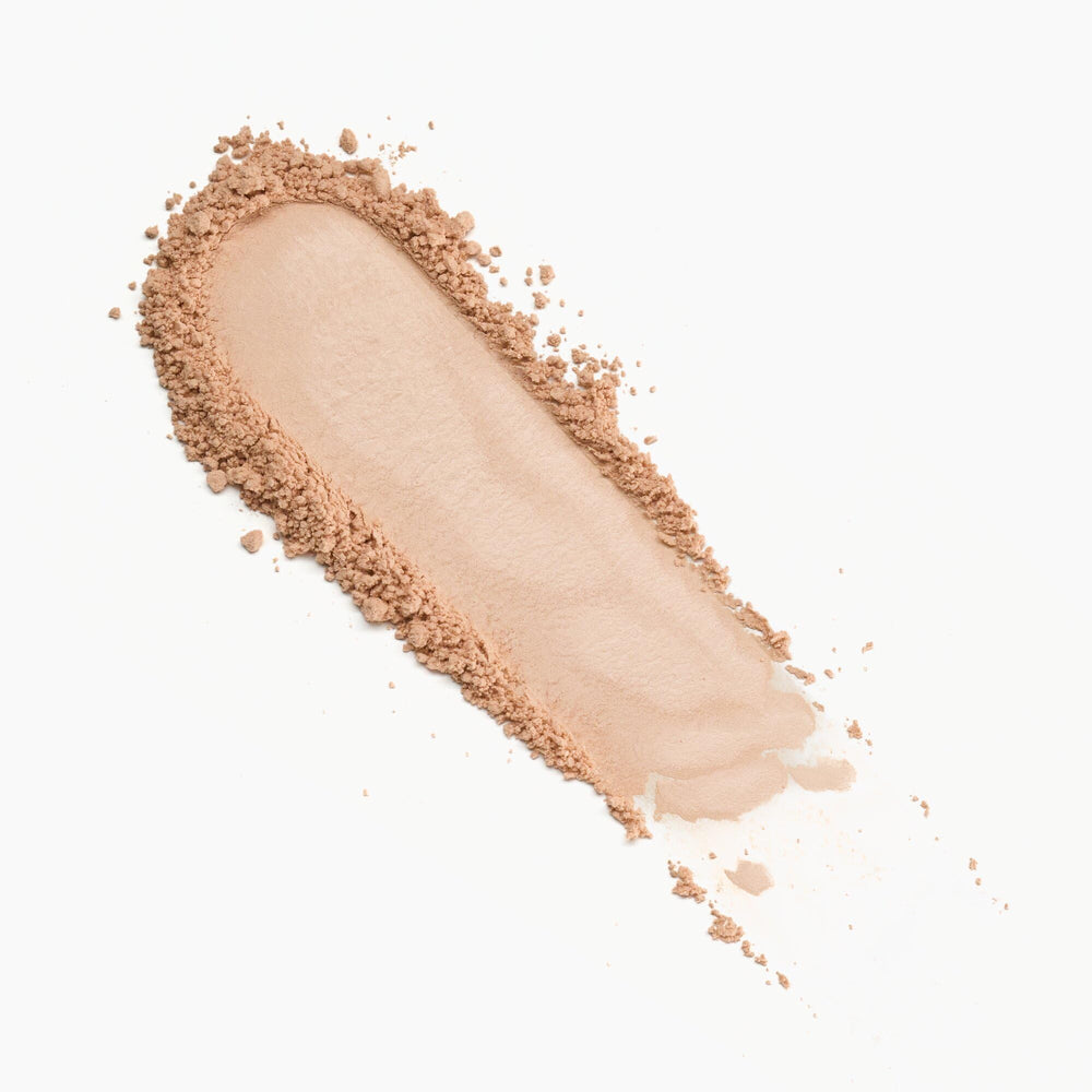 Catrice Under Eye Brightener powder brushed under-eye area for smoothing and brightness.