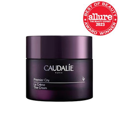 Caudalie Premier Cru cream on palm ready for application and hydration.