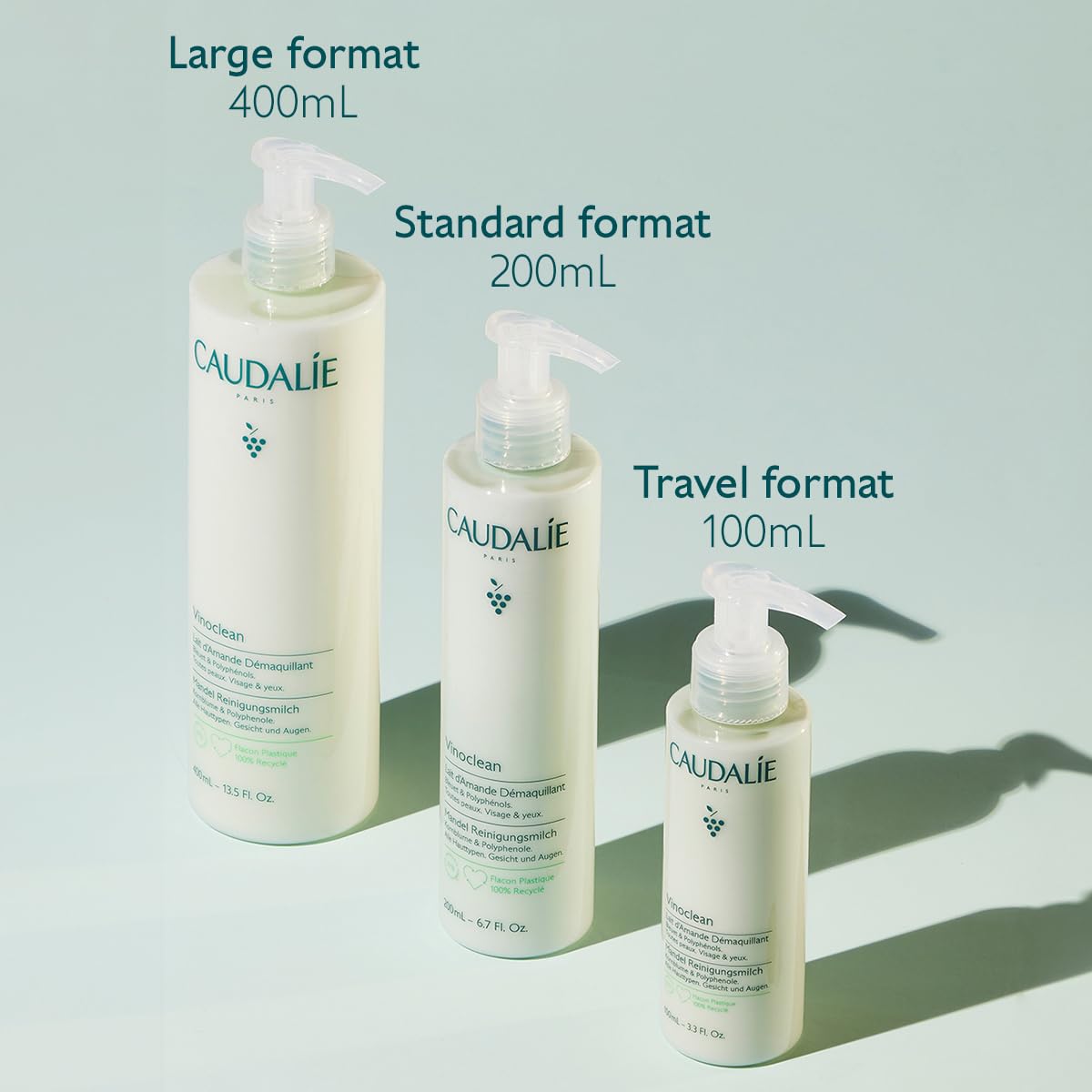 Hands massaging the face and neck with cleansing milk.