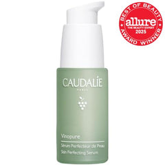 Caudalie Vinopure serum pump closeup highlights precise dispensing for controlled application.