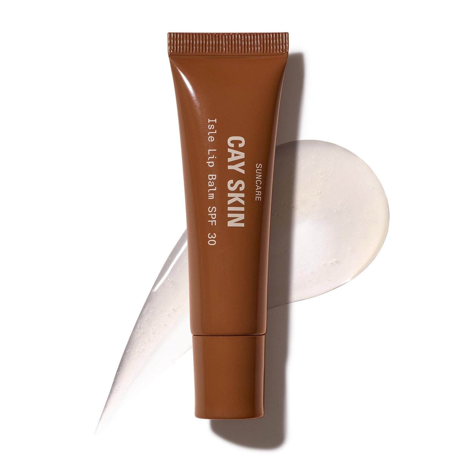 Cay Skin Isle Lip Balm SPF 30 con brillo translúcido para labios hidratados.