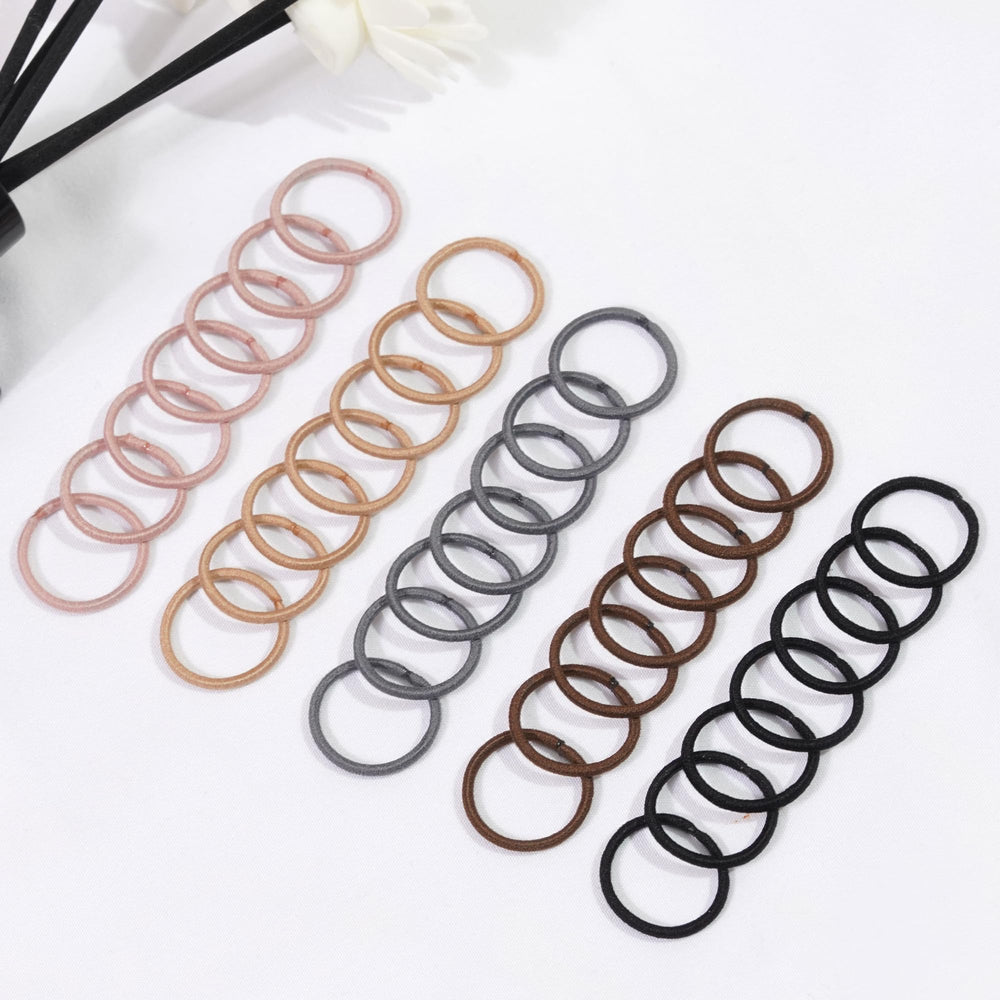 CÉLLOT soft hair ties being worn during play.