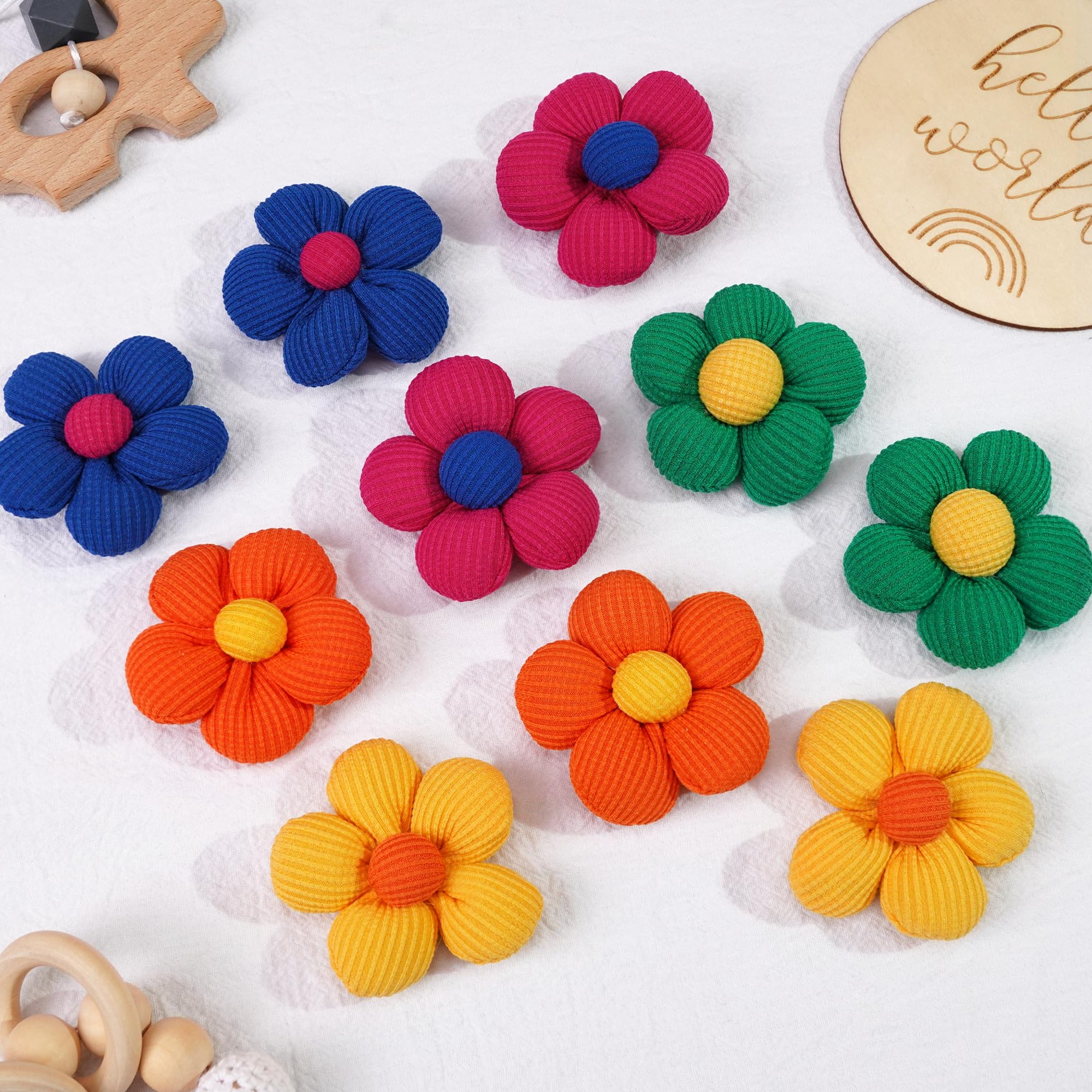 Floral design enhances buns and ponytails with a playful touch.