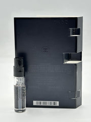 CHANEL Bleu de Parfum Pour Homme swatch on wood desk, suggests versatile daily wear