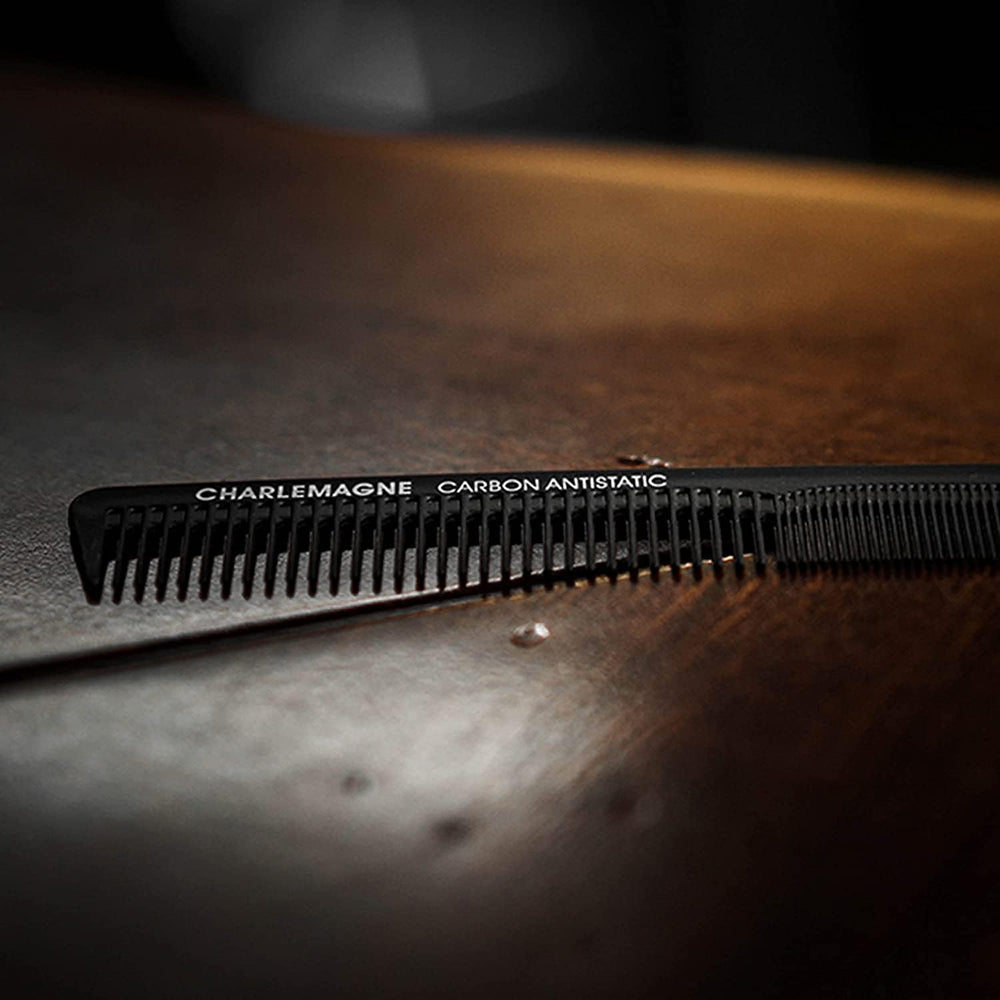 Charlemagne premium carbon comb with logo and ergonomic grip for precise styling.