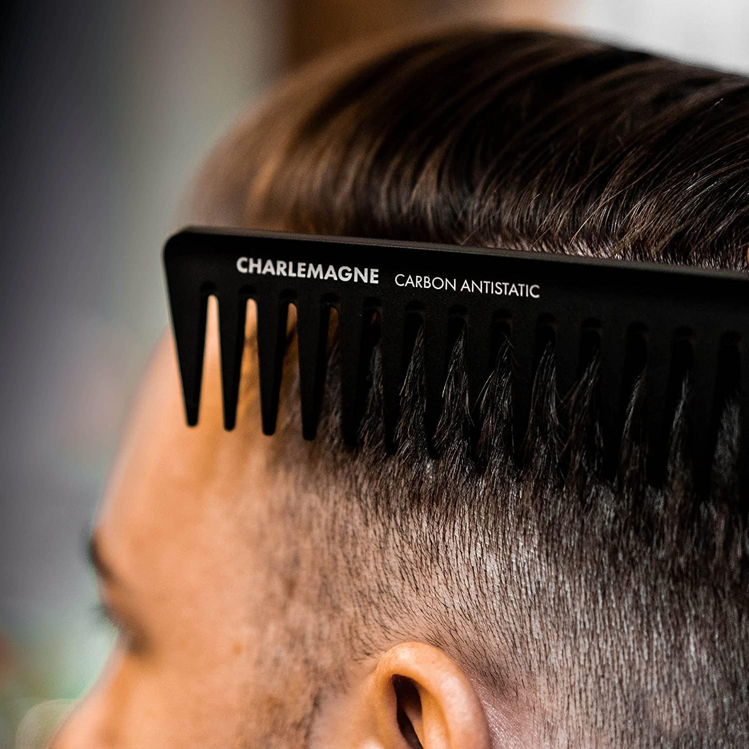 Charlemagne wide tooth comb for slick back styling and lift.