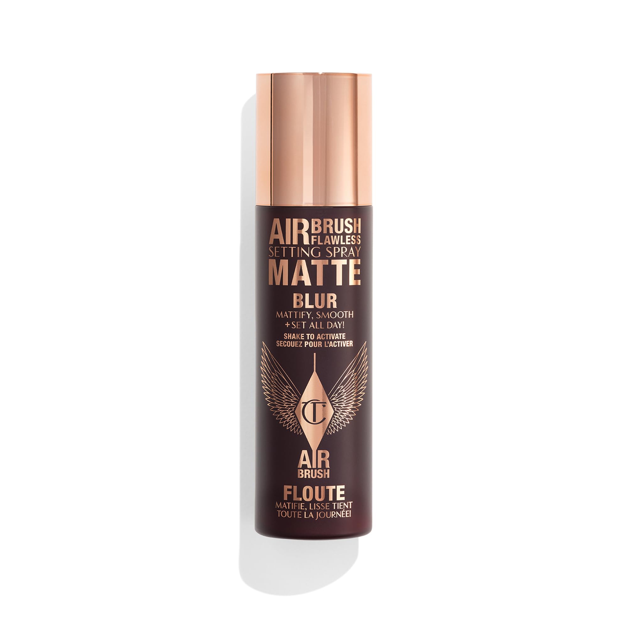 Charlotte Tilbury Airbrush Flawless setting spray bottle primes and locks makeup all day.