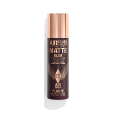 Charlotte Tilbury Airbrush Flawless setting spray bottle primes and locks makeup all day.