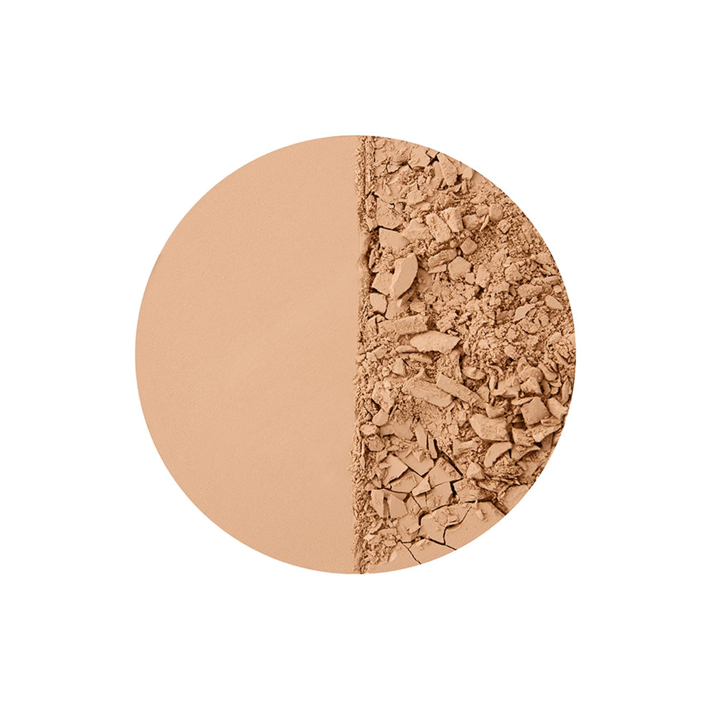 Charlotte Tilbury bronzer applied with a fluffy brush for sun-kissed warmth.