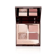 Charlotte Tilbury Exagger-Eyes ivory-cream shade brightens the lid for subtle daytime glow.