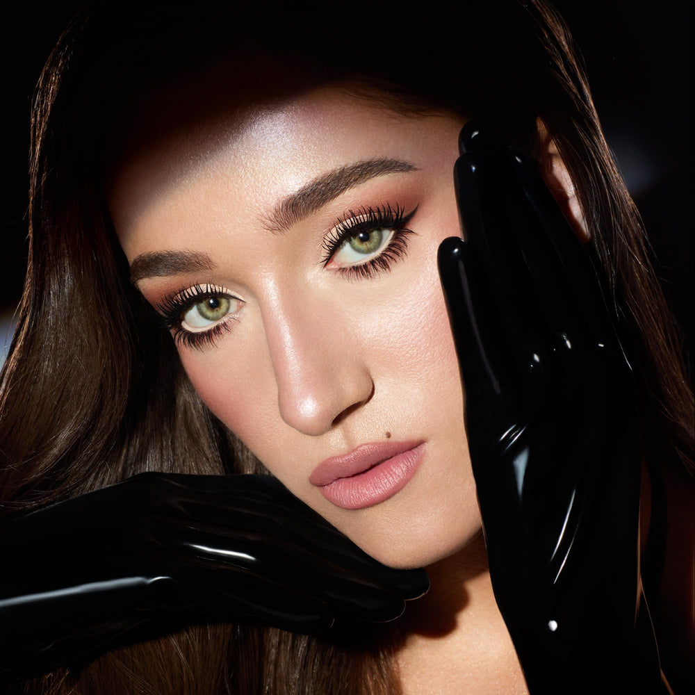 Charlotte Tilbury Exagger-Eyes rose-gold shade delivers a luminous wash for daily radiance.