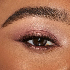 Fingers applying Eyes to Mesmerize Pillow Talk for a soft wash of color