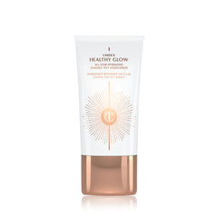 Charlotte Tilbury Healthy Glow Skin Tint bottle close-up showing soft radiance and bronzed warmth