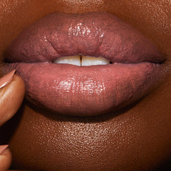 Charlotte Tilbury Hyaluronic Happikiss nude-pink shade offers versatile day-to-night pout.