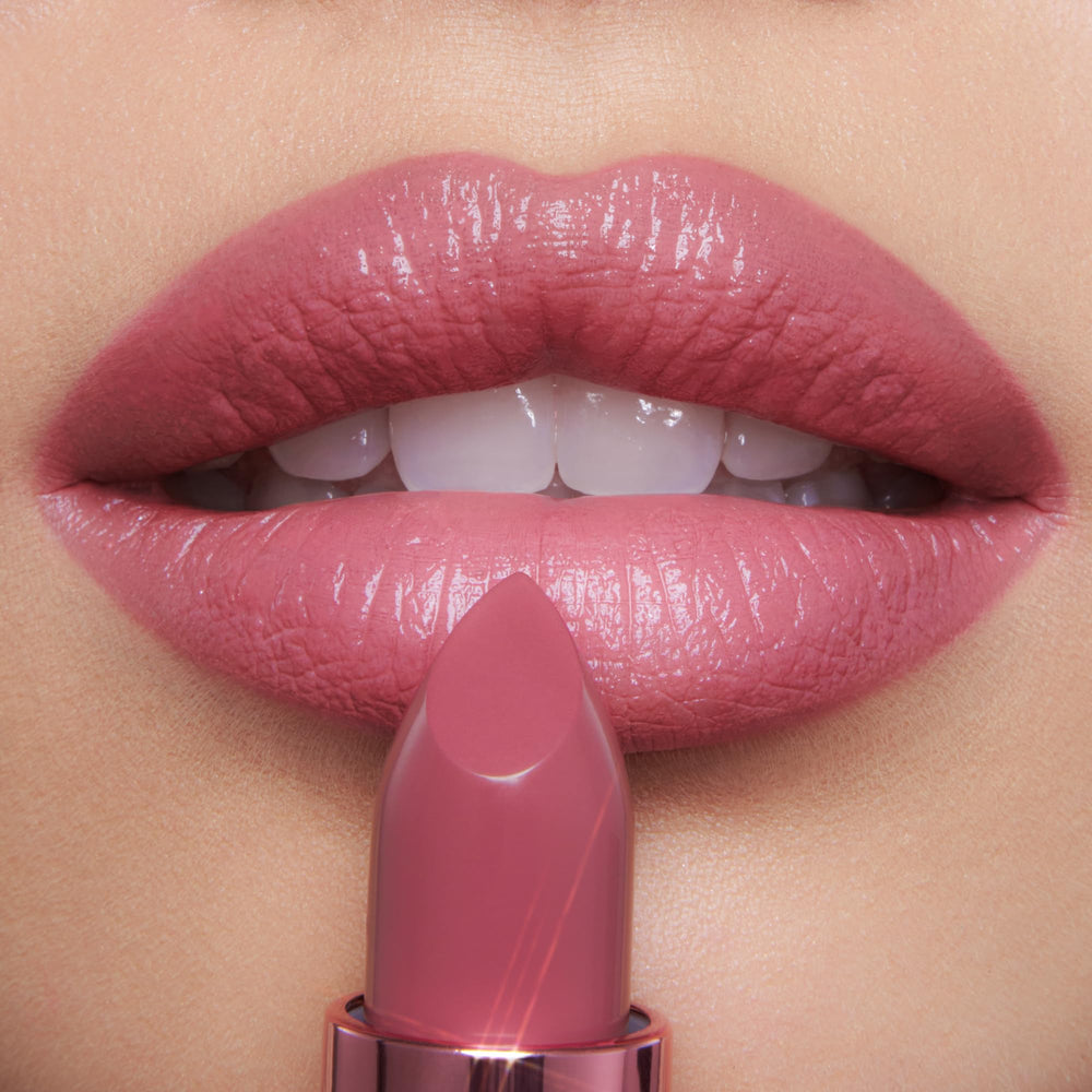 Mini lipsticks arranged in the trio demonstrate portable, leak-free travel packaging.