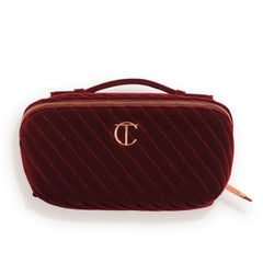 Charlotte Tilbury large travel makeup bag in quilted velvet for organized on the go storage