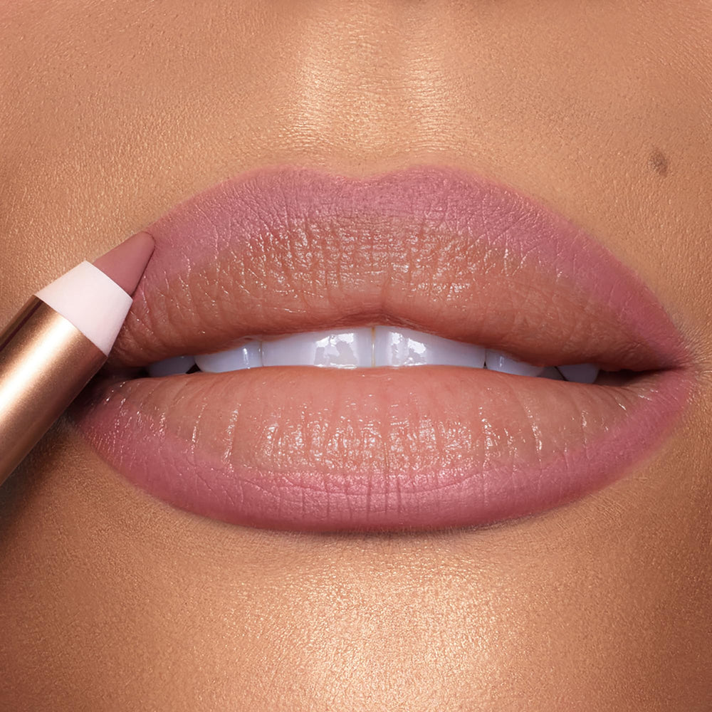 Charlotte Tilbury Lip Cheat Pillow Talk Medium nude-pink shade swatch on skin.