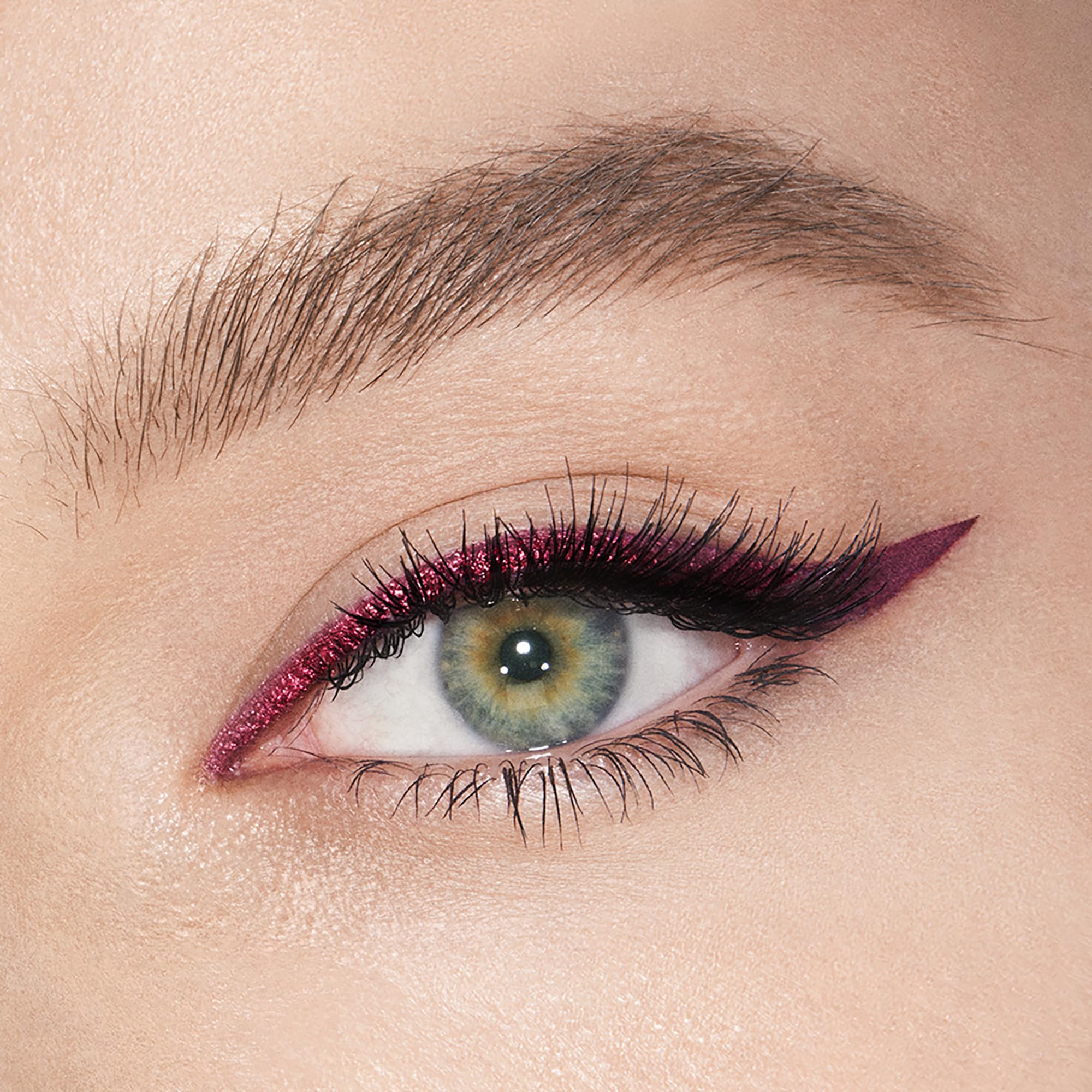 Charlotte Tilbury Magic Eyeliner mesmerising-maroon swatch shows rich color contrast