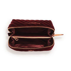 Charlotte Tilbury makeup bag with two compartments and zip pocket keeps cosmetics organized.