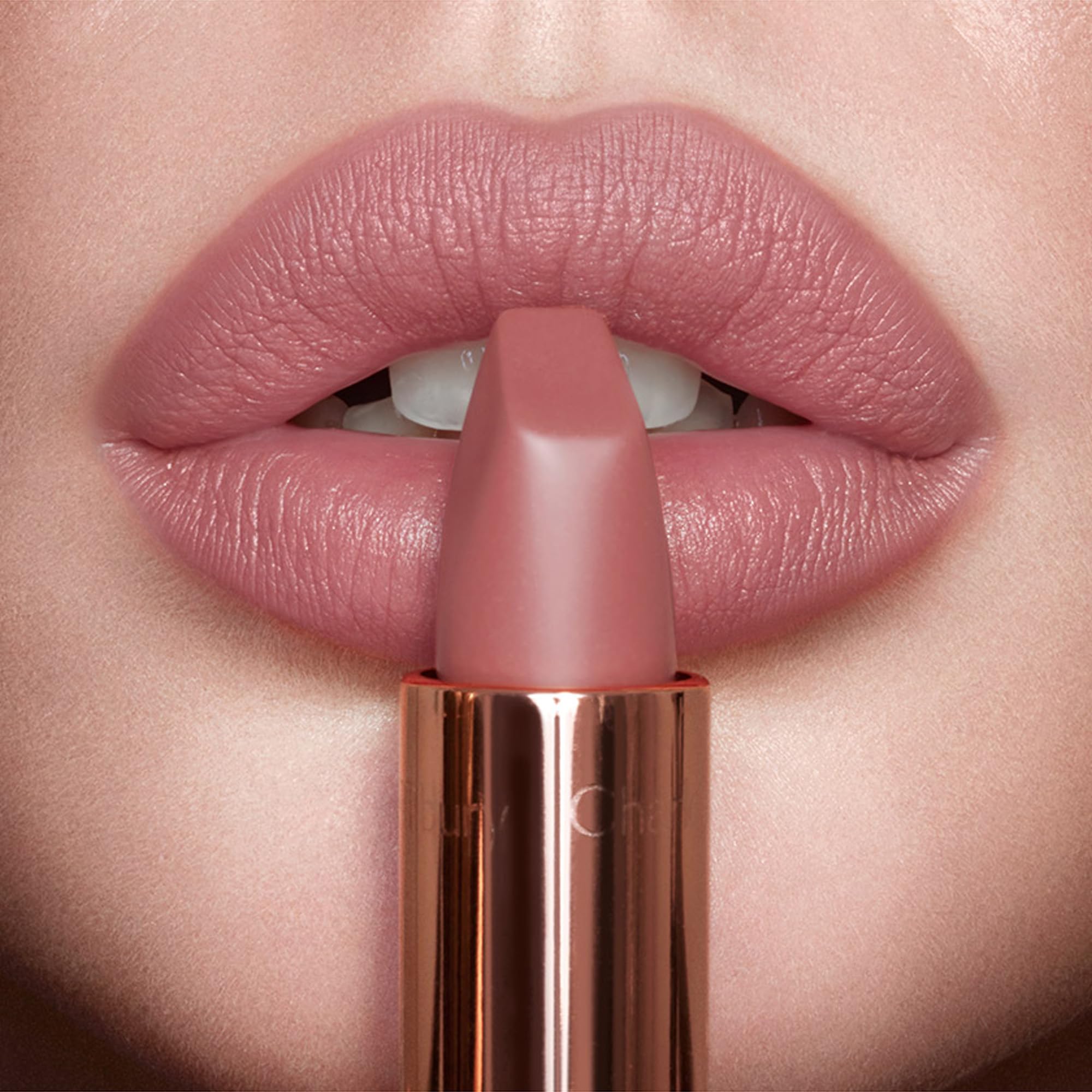 Angled-square-tip in action defining lips with Matte Revolution Pillow Talk