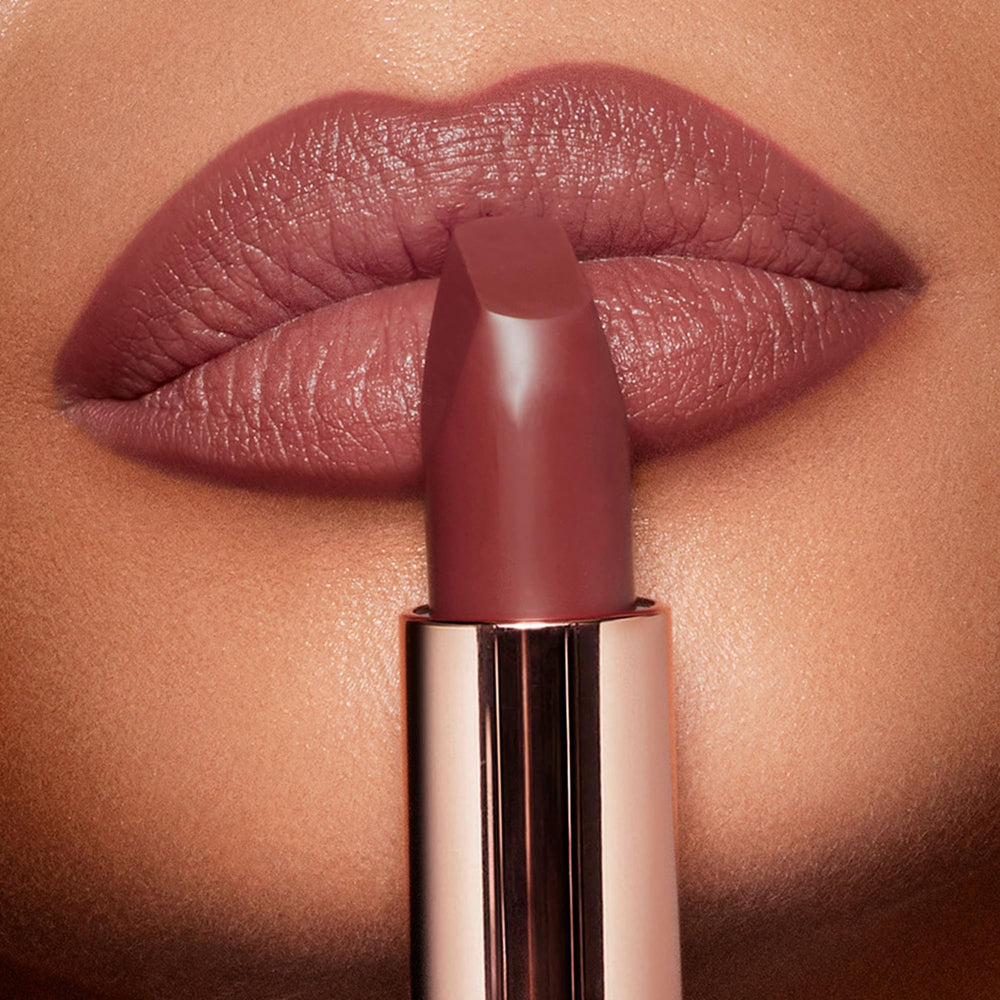 Charlotte Tilbury Pillow Talk Medium close-up showing soft, warm nude-pink hue on lips.