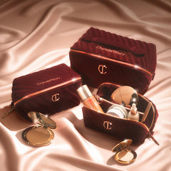 Charlotte Tilbury quilted velvet bag in night crimson adds elegant vanity style.