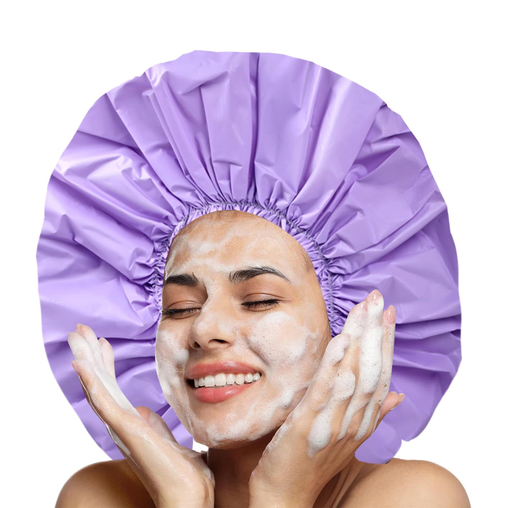 CHFONG jumbo shower cap in purple shields hair while washing.