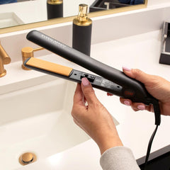 CHI Original Ceramic Flat Iron 1-inch plates in use enabling versatile straightening and curling looks.
