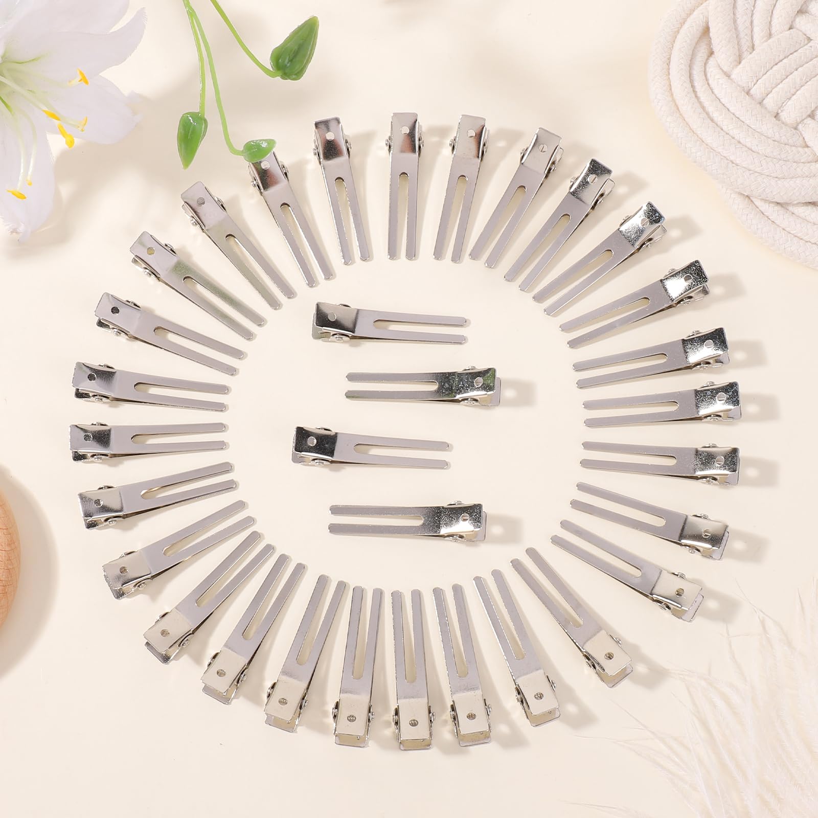 Pinza ChoicBaby de metal plateado con doble diente, sujeción firme para rodillos.