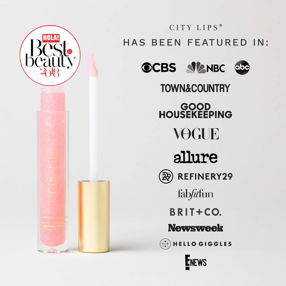 Lip gloss wand applying City Lips Nude York gloss on lips.