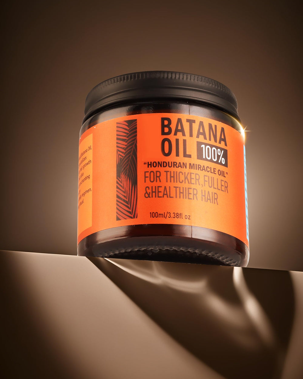 CKOWAJN Batana Oil drop closeup shows nano-sized particles for fast absorption and shine.