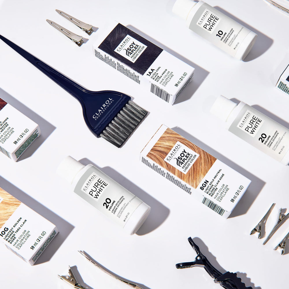 Clairol Professional Liquicolor dye applied to a hair section for rich tone