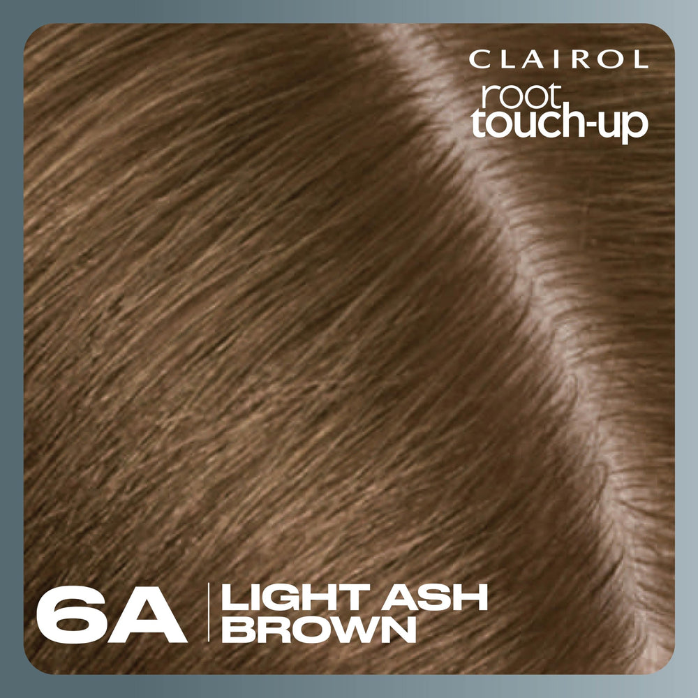 Bathroom counter with Clairol Root Touch-Up ready to use.