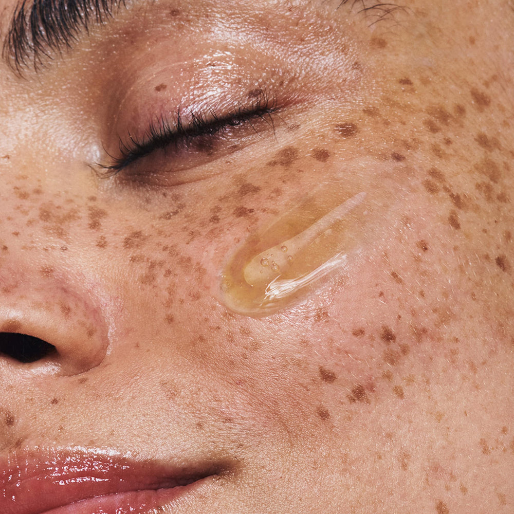 Clarins Double Serum pore refinement view shows smoother texture around cheeks.