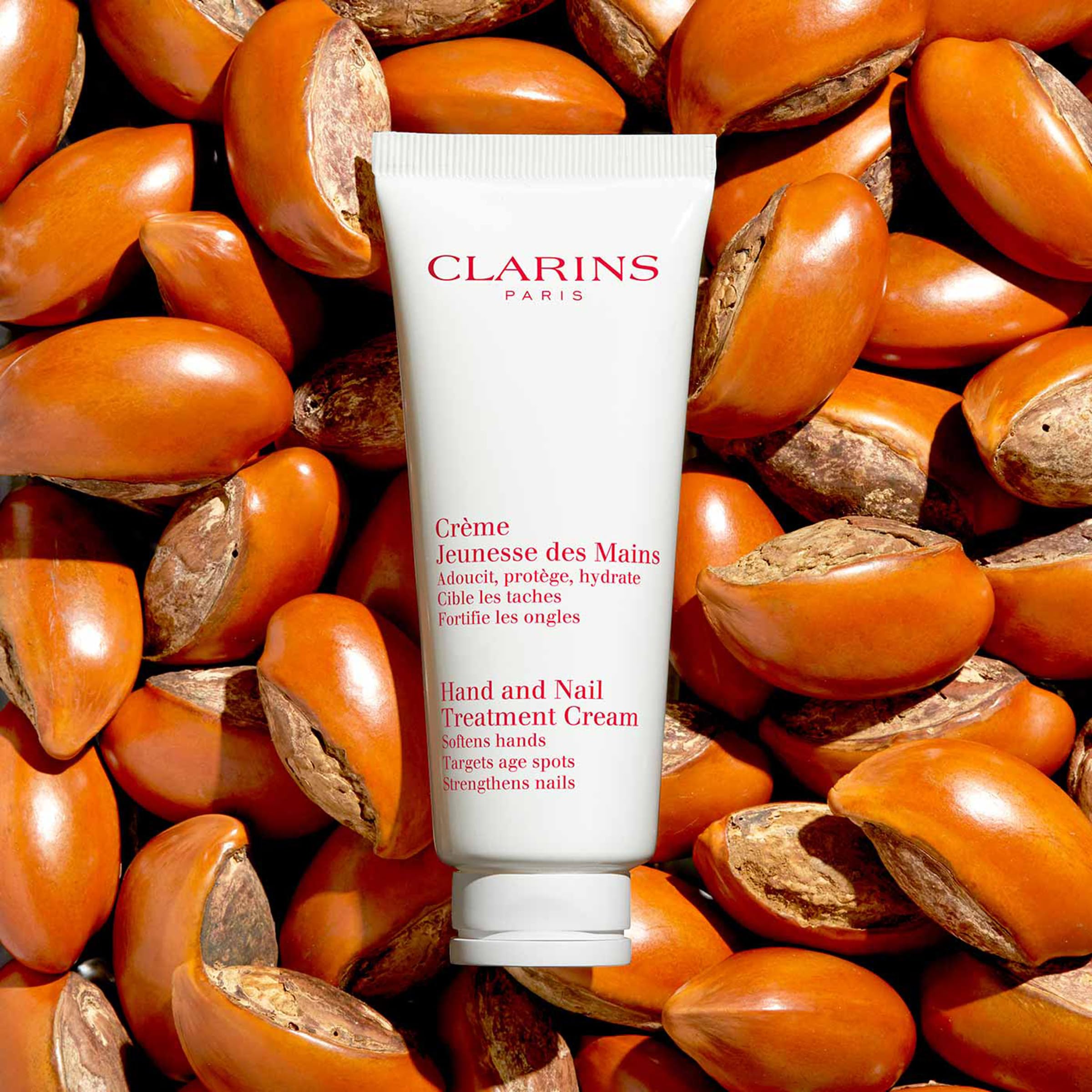 Clarins Hand and Nail Treatment Cream on nails and cuticles for conditioning.