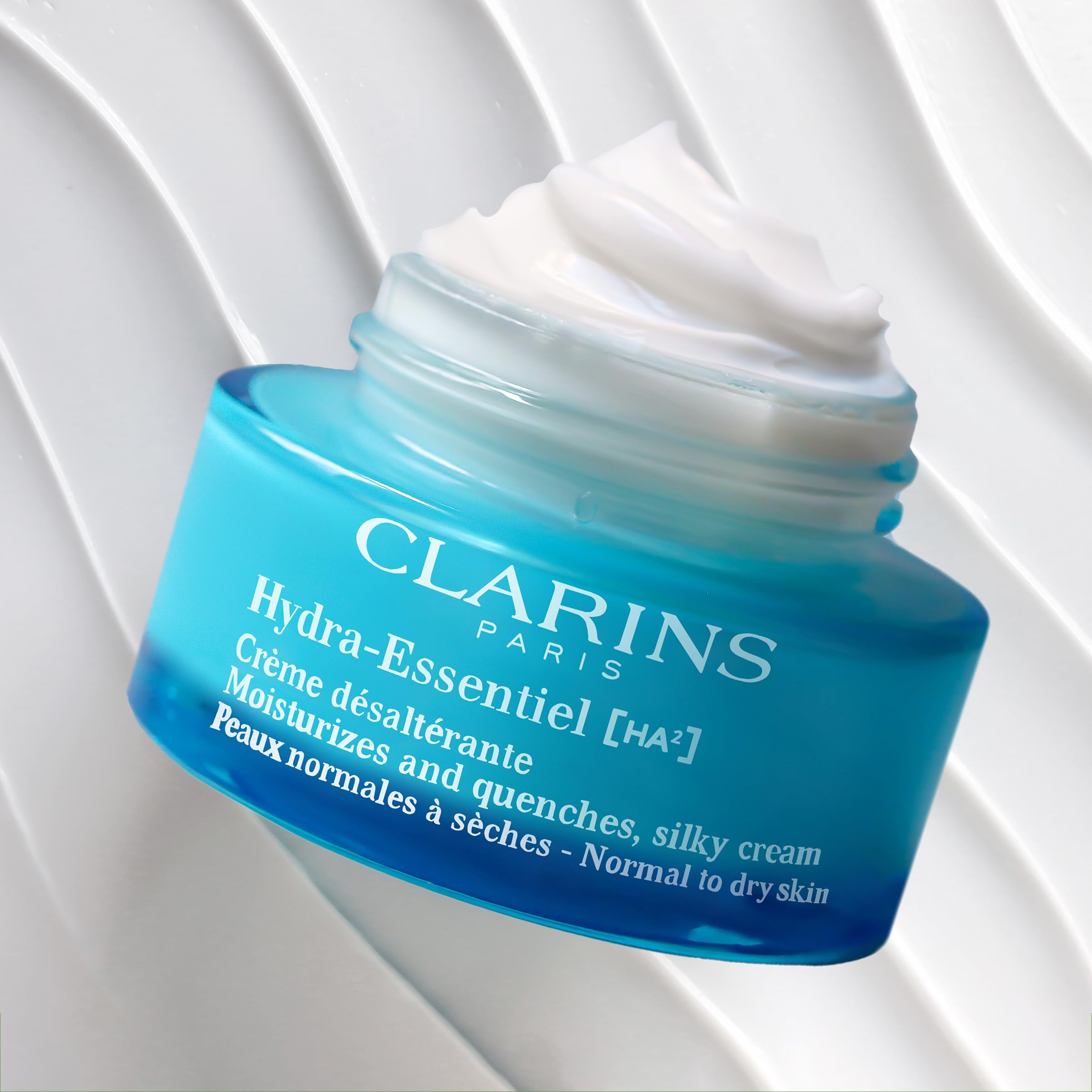 Clarins Hydra-Essentiel Silky Cream massage demonstrates silky glide during routine.