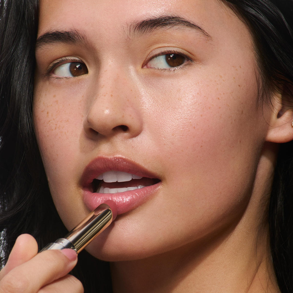 Clarins Lip Oil Balm Lychee offers 24h hydration for lasting comfort.