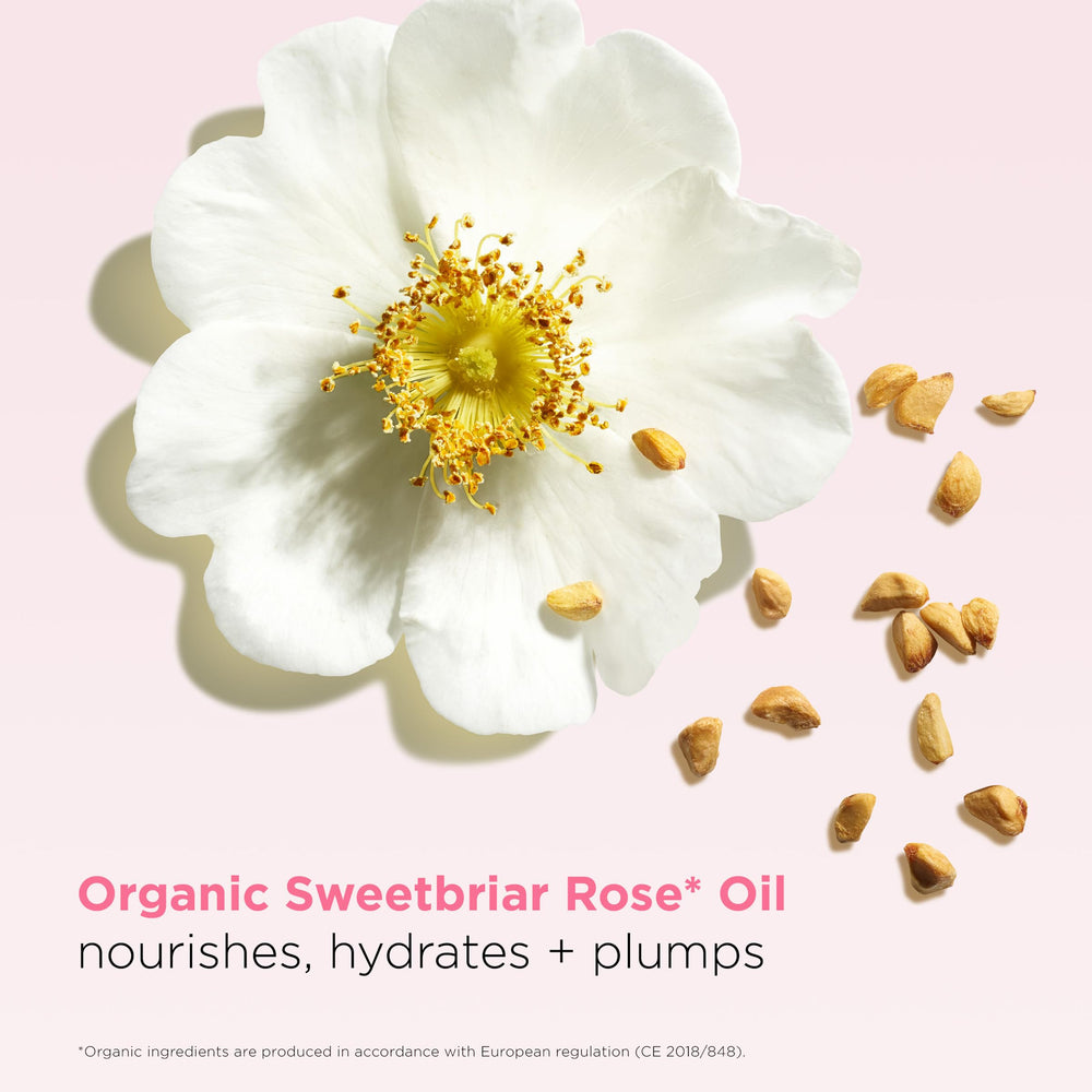 Clarins Lip Oil Balm hydration close-up emphasizes moisturizing effect.