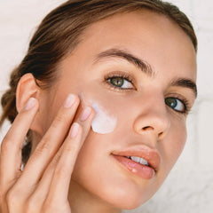 Neck and décolleté application of Clarins Multi-Active Night Moisturizer